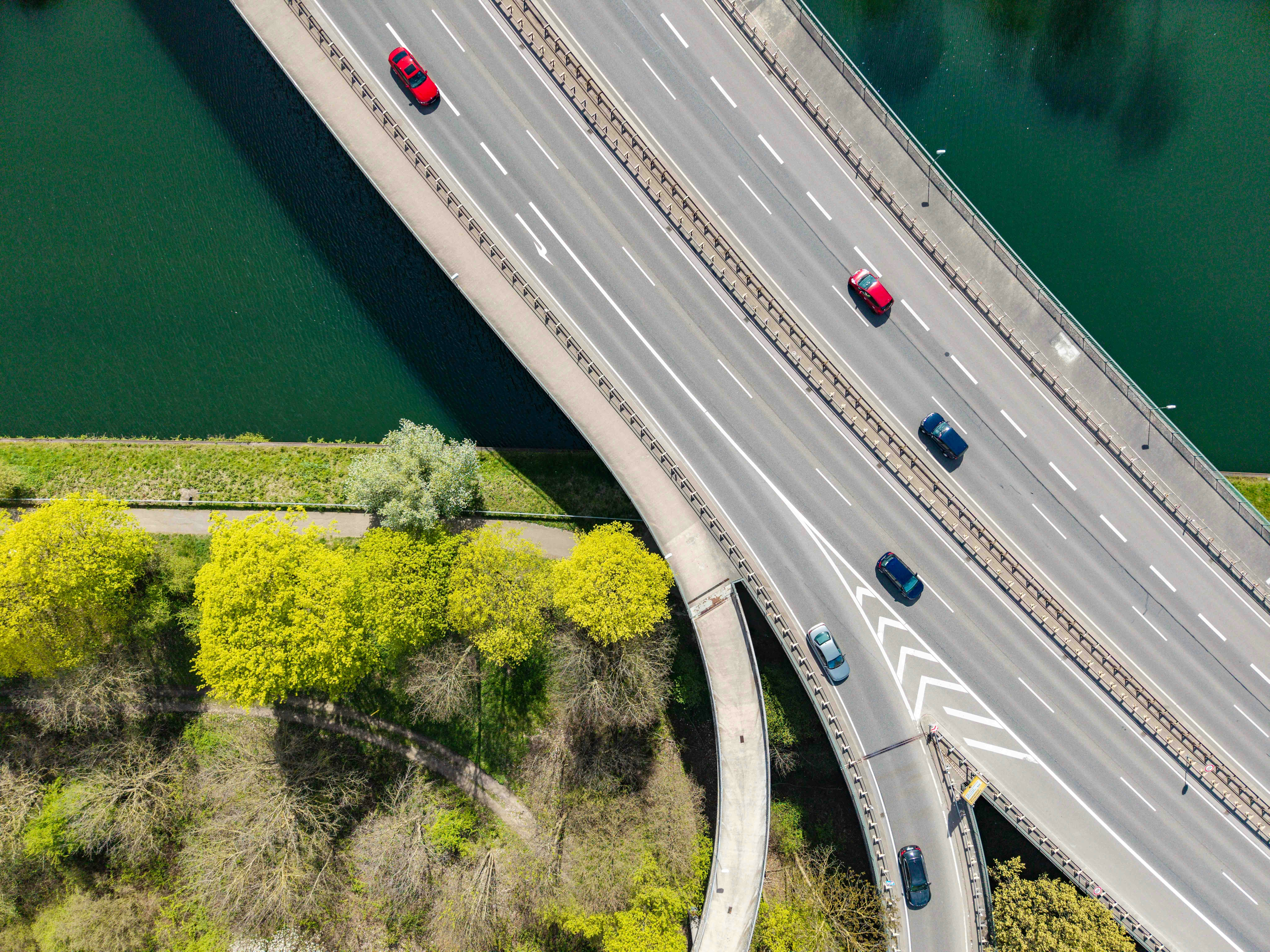 An aerial view of a motorway junction on a bridge over water