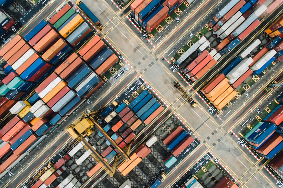 An aerial view of multi-coloured containers in a shipyard