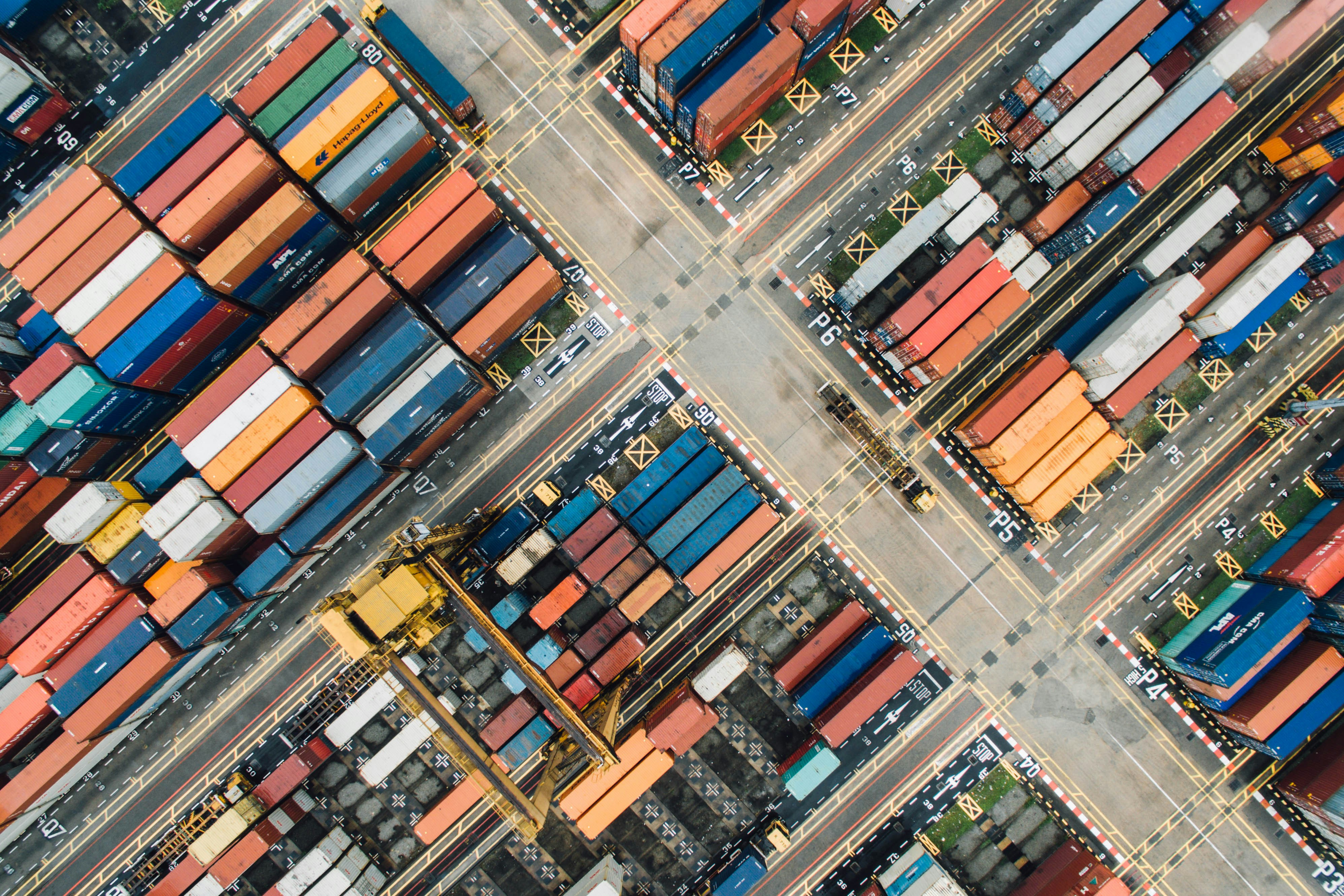 An aerial view of multi-coloured containers in a shipyard