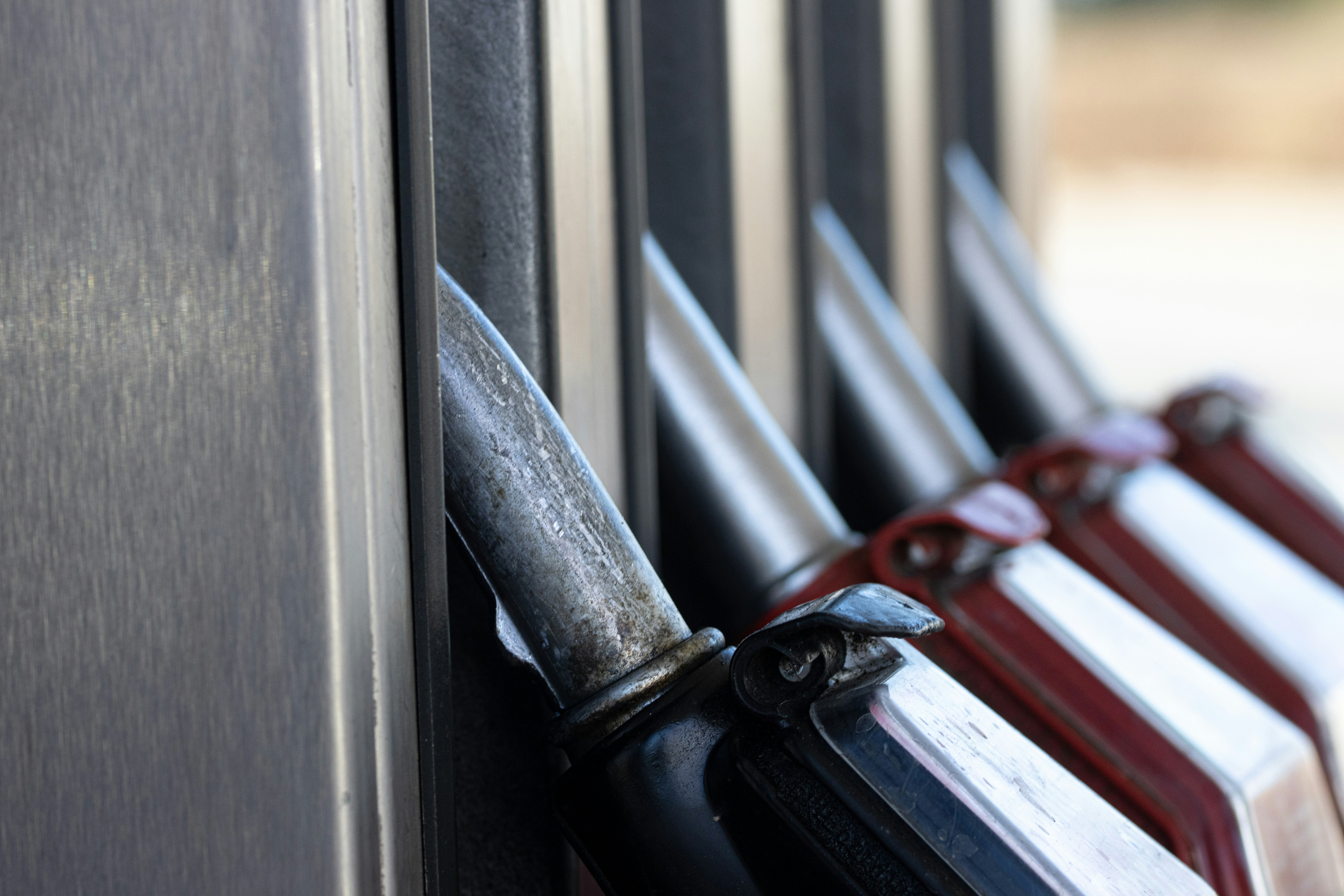 A close-up shot of fuel pumps at a petrol station